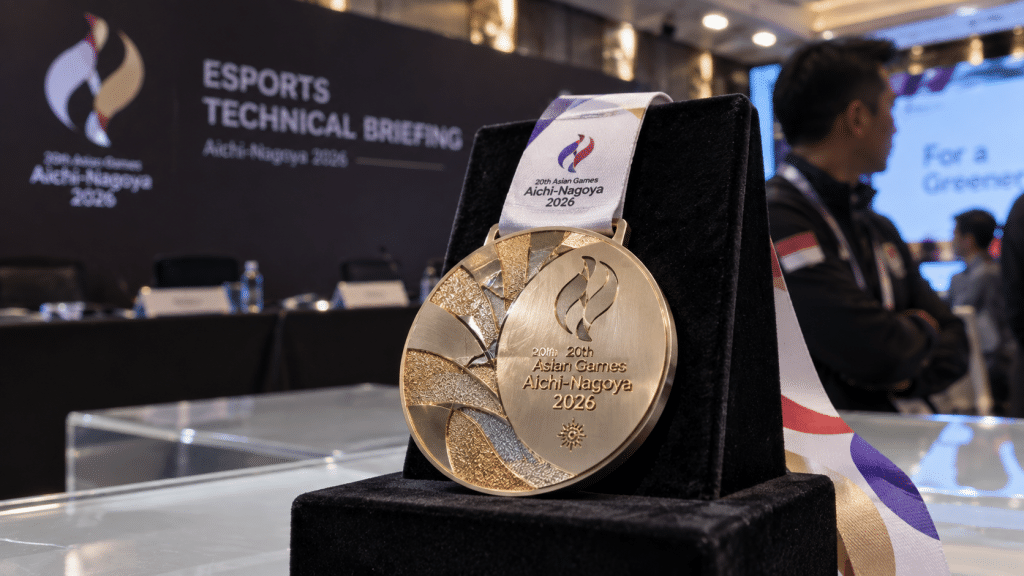 Detail medali resmi Asian Games Aichi-Nagoya di area pameran cabang esports MLBB Asian Games 2026.